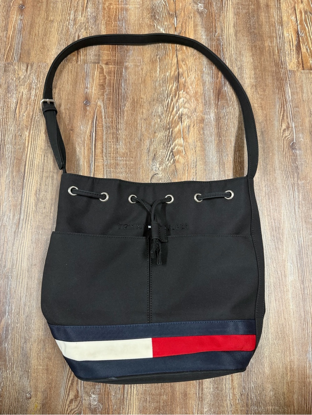 Vintage Y2K Tommy Hilfiger black bucket bag with red, white, and navy blue horiz